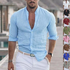 Men's Long Sleeve Shirt With Button Casual Solid Color Tops For Spring Autumn in light blue with rolled-up sleeves.