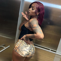 A woman showcasing Women's Sexy American Hot Girl Tiger Stripe Pattern Rope Shorts in a stylish pose.