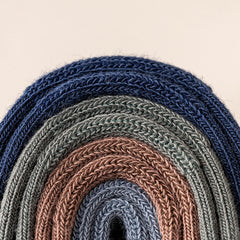 Sweat Absorbing Japanese Solid Five Toe Socks in various colors stacked neatly.