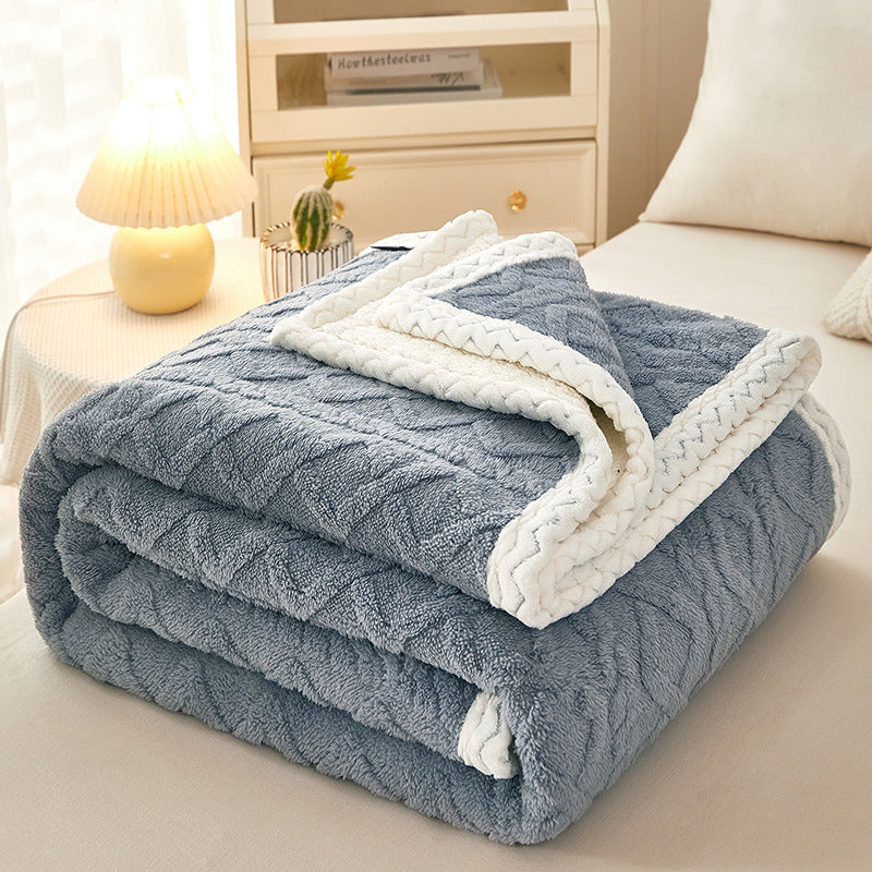 Blanket Double Thickened Warm Coral Fleece Sofa Blanket in blue color on a sofa, perfect for winter warmth.