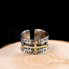 Character Thai S925 Silver Jewelry featuring a geometric cross ring design on a wooden surface.
