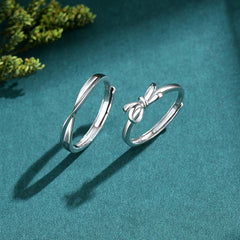 S925 Silver Bow Couple Ring showcasing two elegant silver rings on a teal background, perfect for fashion jewellery.