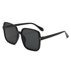 Men And Women With Fashion Simple Sunglasses with a stylish black frame and dark lenses