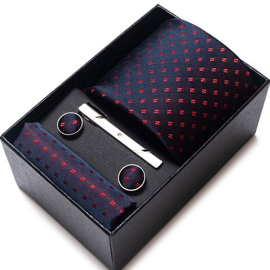 Elegant men's tie set in black box, featuring a patterned tie, cufflinks, and tie clip for stylish accessorizing.