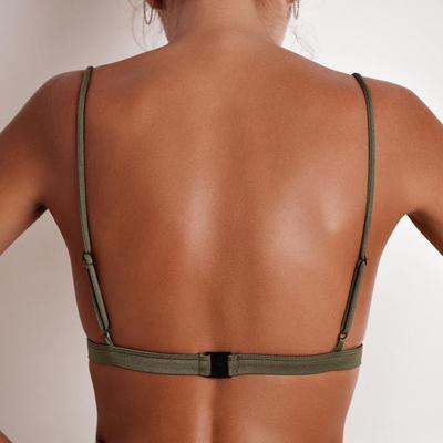 Back view of a bikini women's swimsuit top in solid color with skinny straps and open back design.