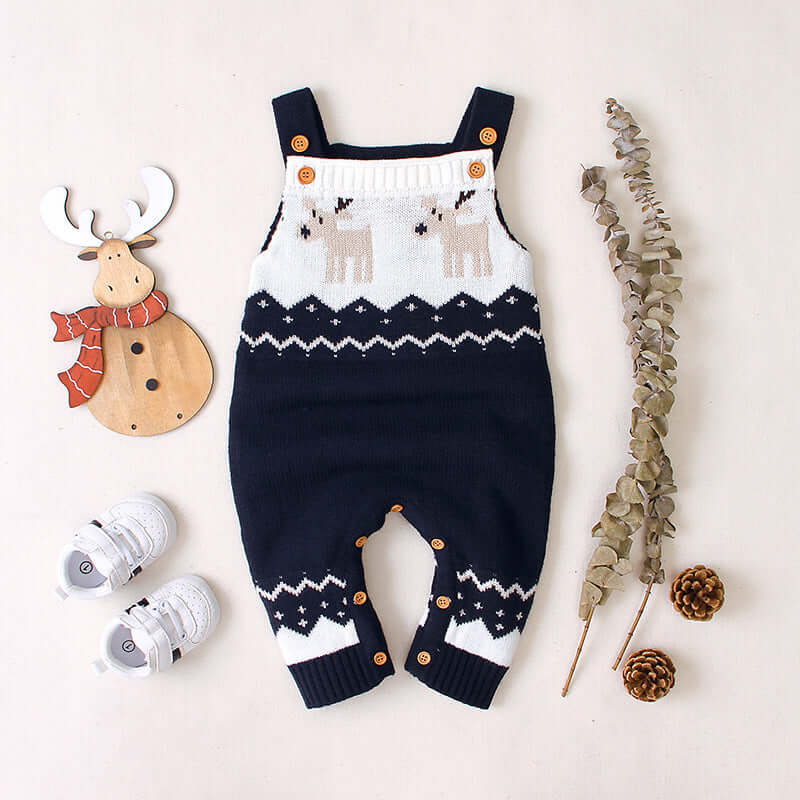 Children's sling Christmas elk jumper styled with festive decorations and accessories.