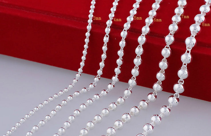 Round Beads Silver Bead Necklace showcasing various bead sizes on a red background for fashion jewellery.