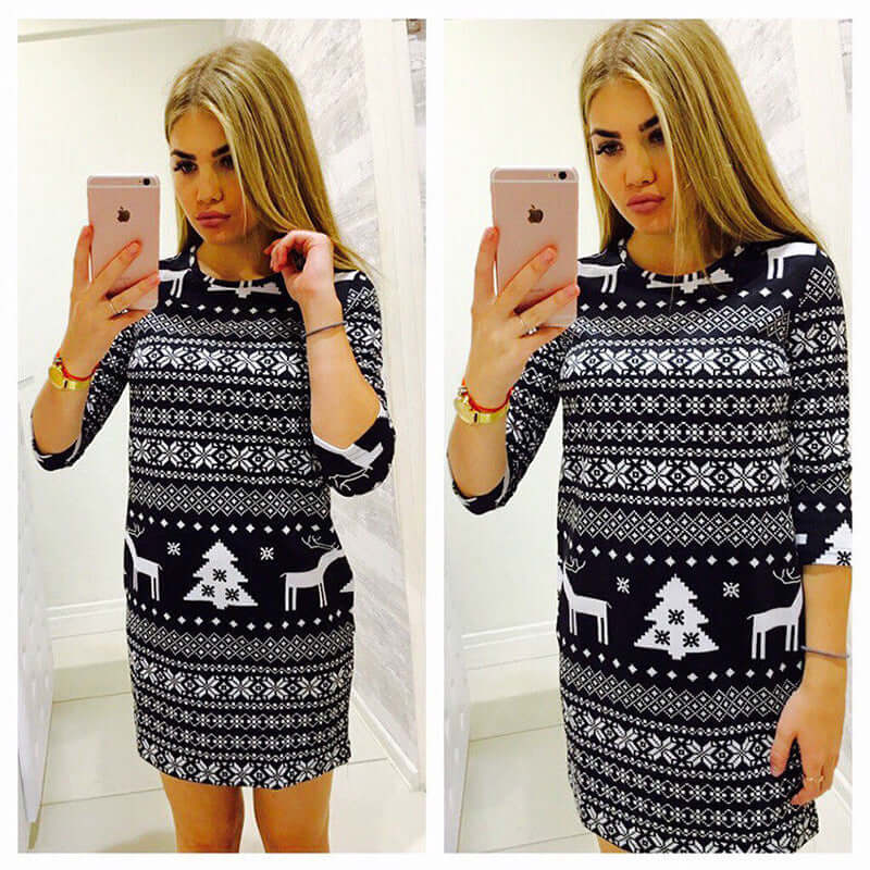 Christmas Jumper Sweater Christmas Deer Warm Knitted Top Plus Size worn by a young woman posing in front of a mirror.