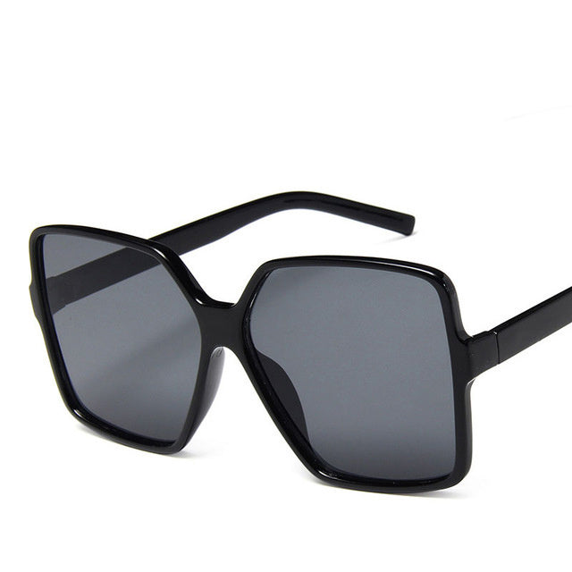 Trendy Sunglasses Fashion Men And Women Big Frame Sunglasses in black frame with grey lenses.