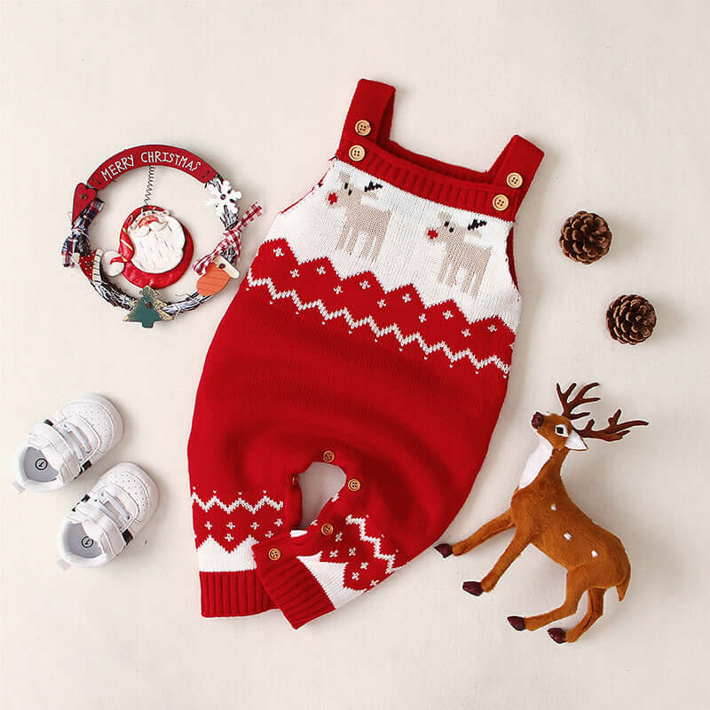 Children's sling Christmas elk jumper in red with festive decorations and accessories.