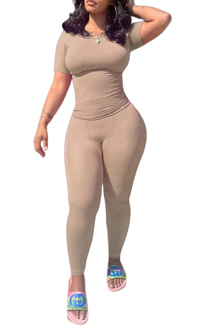 Model wearing Short Sleeved Pants in a stylish beige color, perfect for casual or light sports activities.