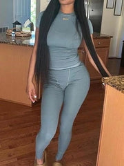 Short Sleeved Pants set featuring a form-fitting short sleeved top and long pants in a stylish light blue color.