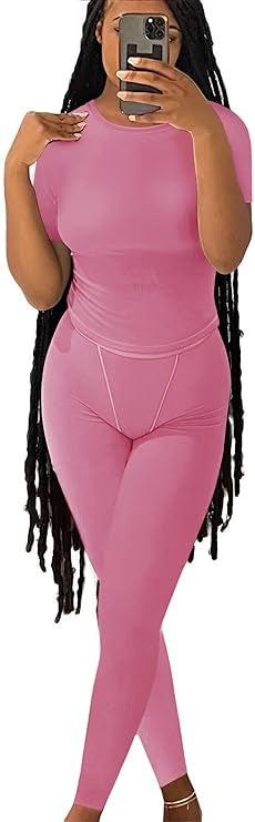 Short Sleeved Pants - Women modeling pink short sleeved top with matching fitted pants, ideal for casual and athletic wear.