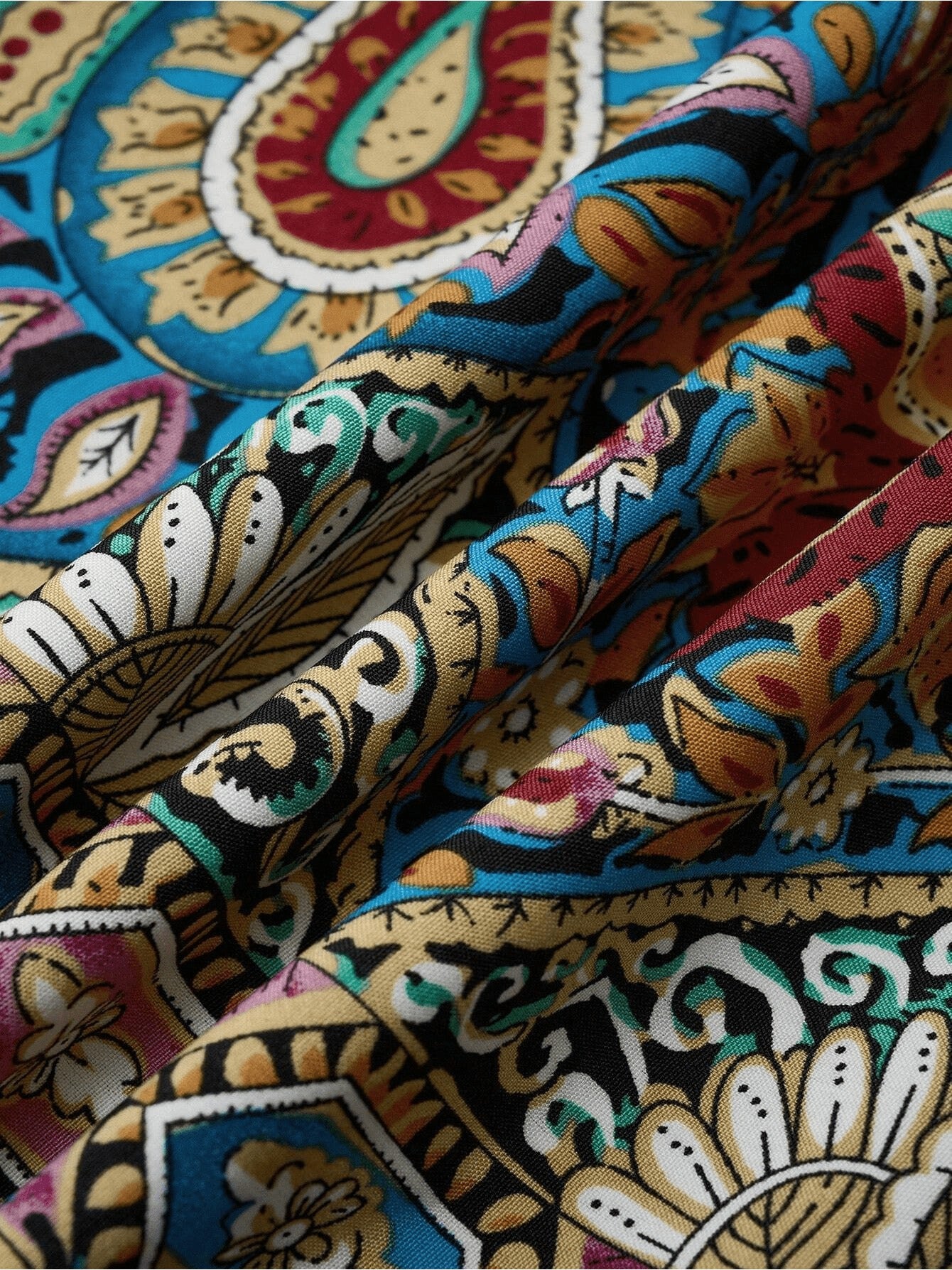women maxi dress fabric detail featuring colorful tropical paisley pattern in rich hues.