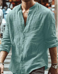 Men's Long Sleeve Shirt With Button Casual Solid Color Tops For Spring Autumn in light blue worn outdoors.