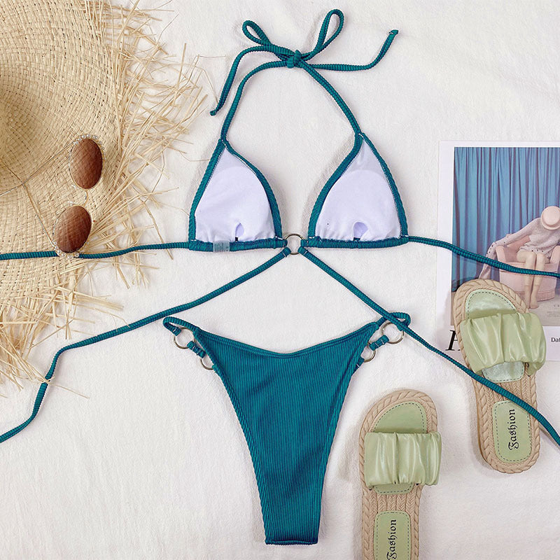 Women Swimwear Sexy Beach Bikini Set Bathing Suit in green color, includes top and bottom, styled with beach accessories.