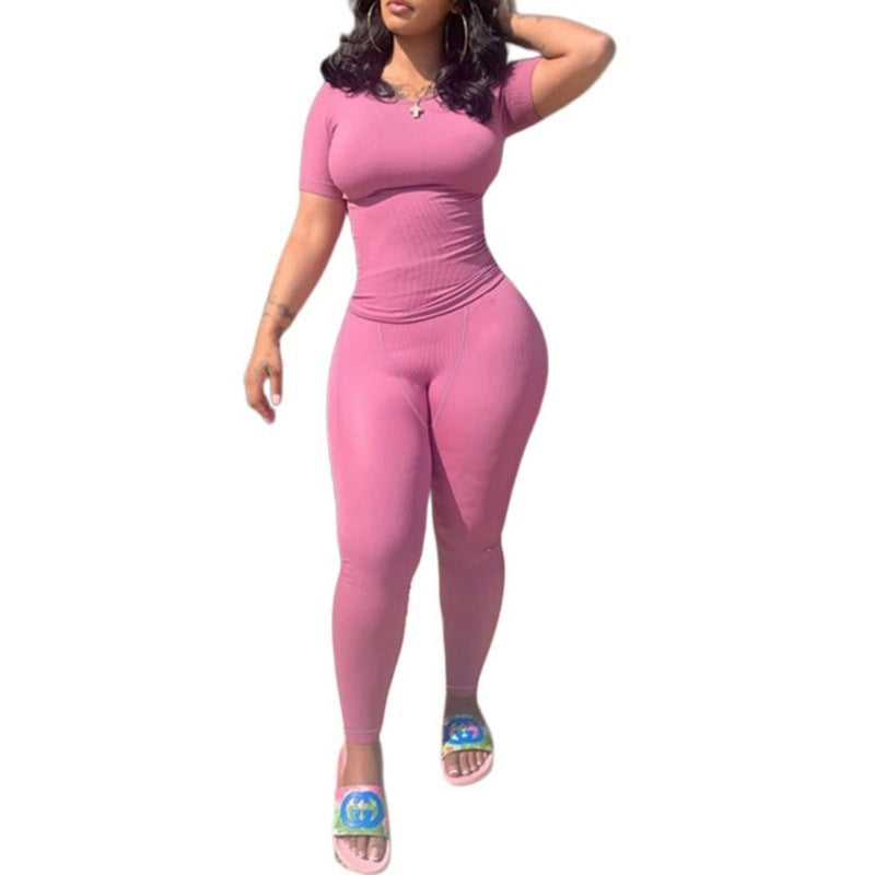 Short Sleeved Pants in pink, featuring a fitted short sleeved top and long leggings, perfect for casual wear.