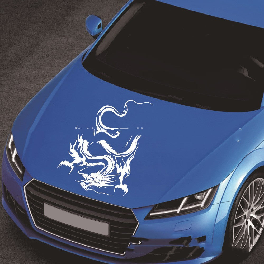 Car sticker modification front end featuring a dragon design on a blue car, adding a stylish touch.
