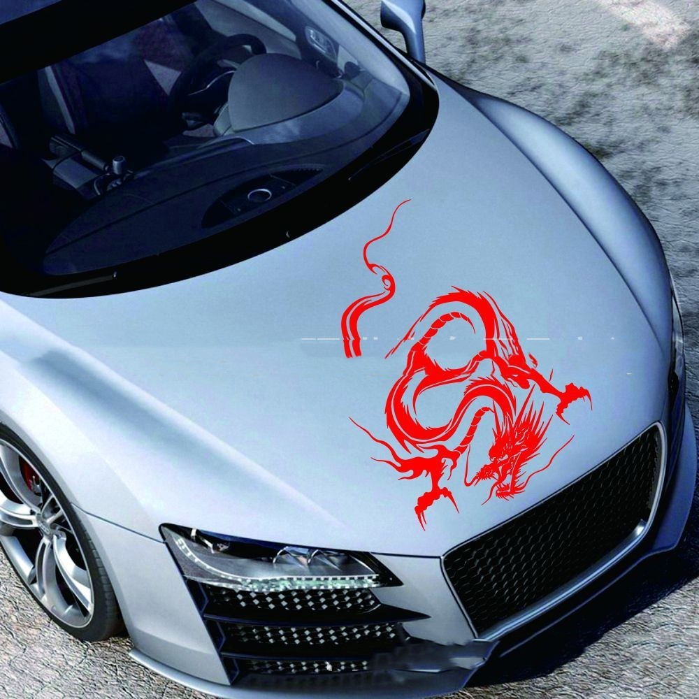 Car sticker modification front end featuring a red dragon design on a silver car hood.