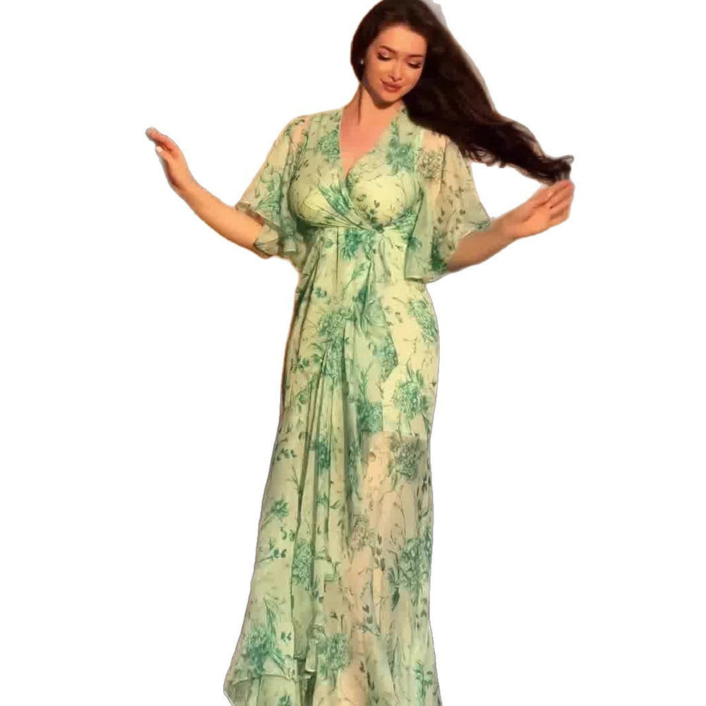 Soft Fresh And Sexy Short Sleeve Floral Dress featuring a flowy floral design in green with short sleeves.