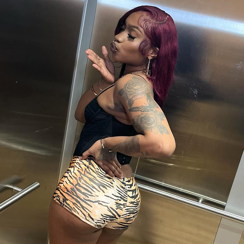 A woman showcasing Women's Sexy American Hot Girl Tiger Stripe Pattern Rope Shorts in a stylish pose.