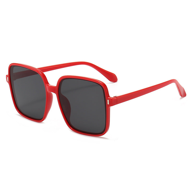 Men And Women With Fashion Simple Sunglasses in red frame with black lenses for a stylish look.