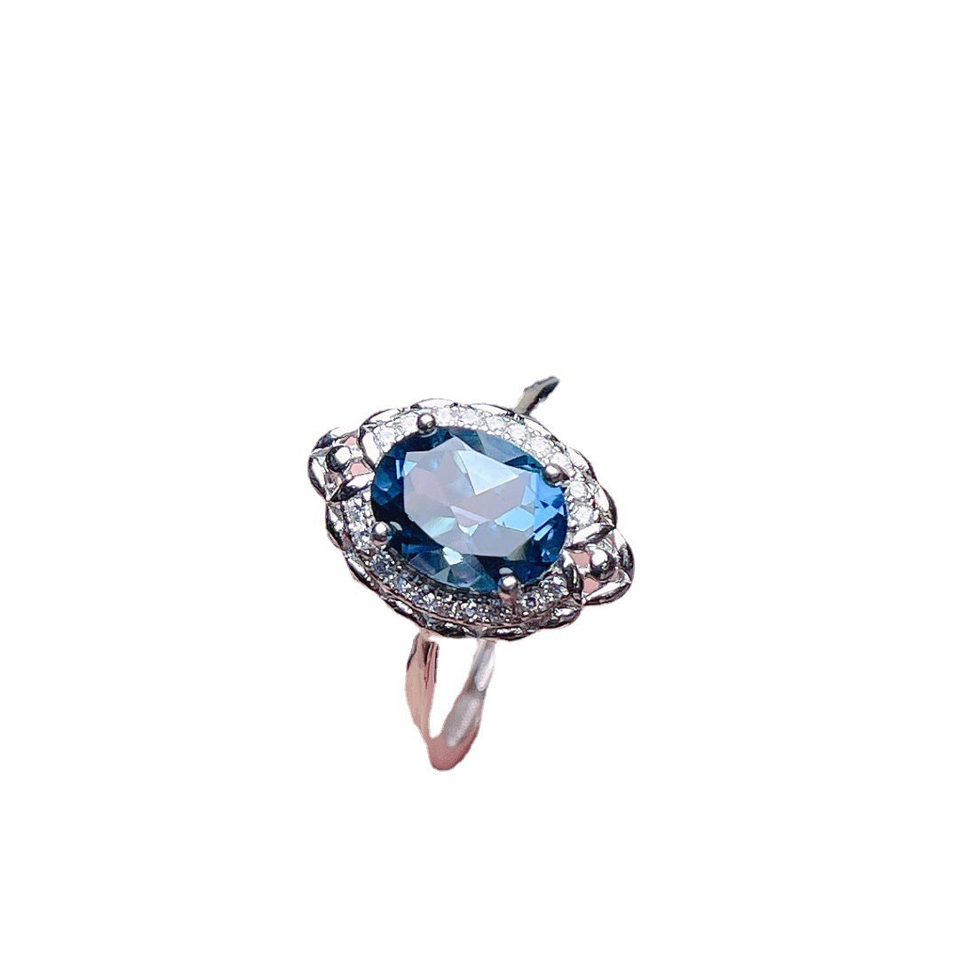 Jewelry Natural Topaz Ring S925 Silver featuring an elegant blue topaz stone and intricate silver design.
