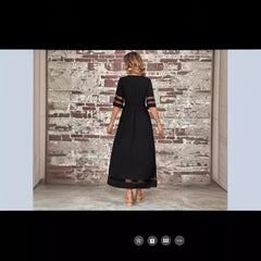 New Hot Sale Five-quarter Sleeve Mesh Patchwork Round Neck Pocket Dress in black with a fishtail skirt.
