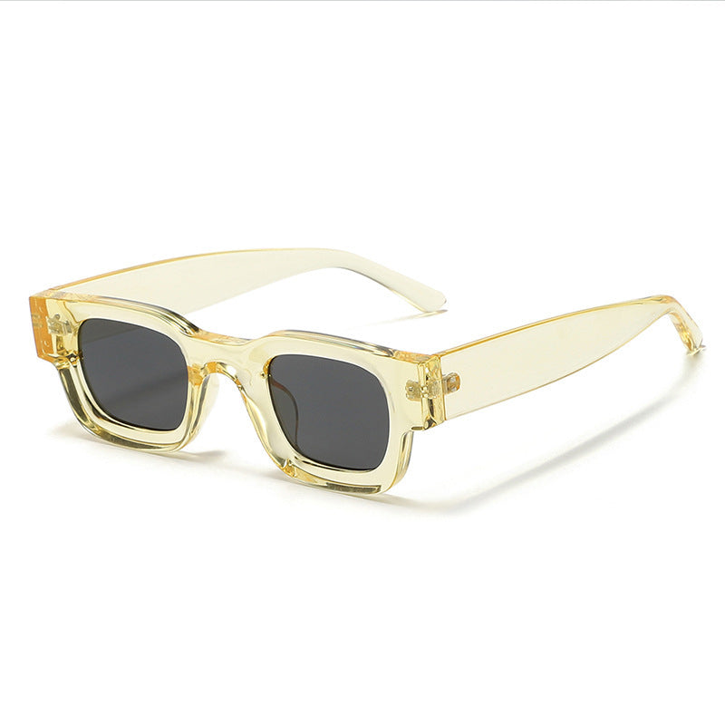 Retro Small Frame Sunglasses For Men in transparent yellow with black lenses, UV400 protection, fashion accessory.