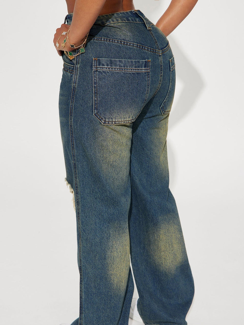 Retro Heavy-duty Washed Knee Ripped Wide-legged Jeans showcasing the back view, featuring a relaxed fit in sea blue denim.