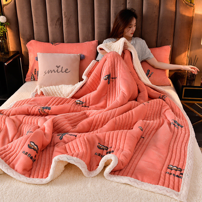 Cashmere Three-layer Blanket Thickened Warm Feather Silk Blanket in coral color with woman lounging on bed.