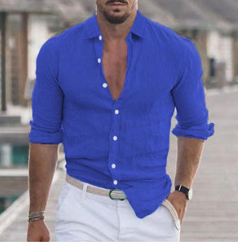 Men's Long Sleeve Shirt With Button Casual Solid Color Tops For Spring Autumn in vibrant blue worn with white pants.