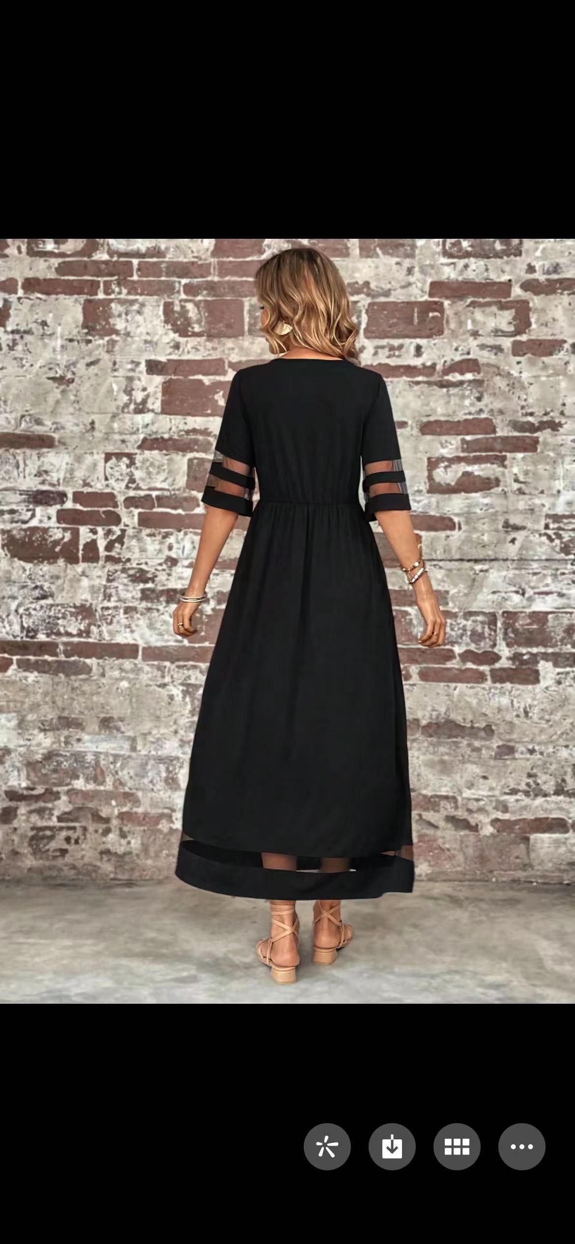 Back view of the New Hot Sale Five-quarter Sleeve Mesh Patchwork Round Neck Pocket Dress on a model against a brick wall.