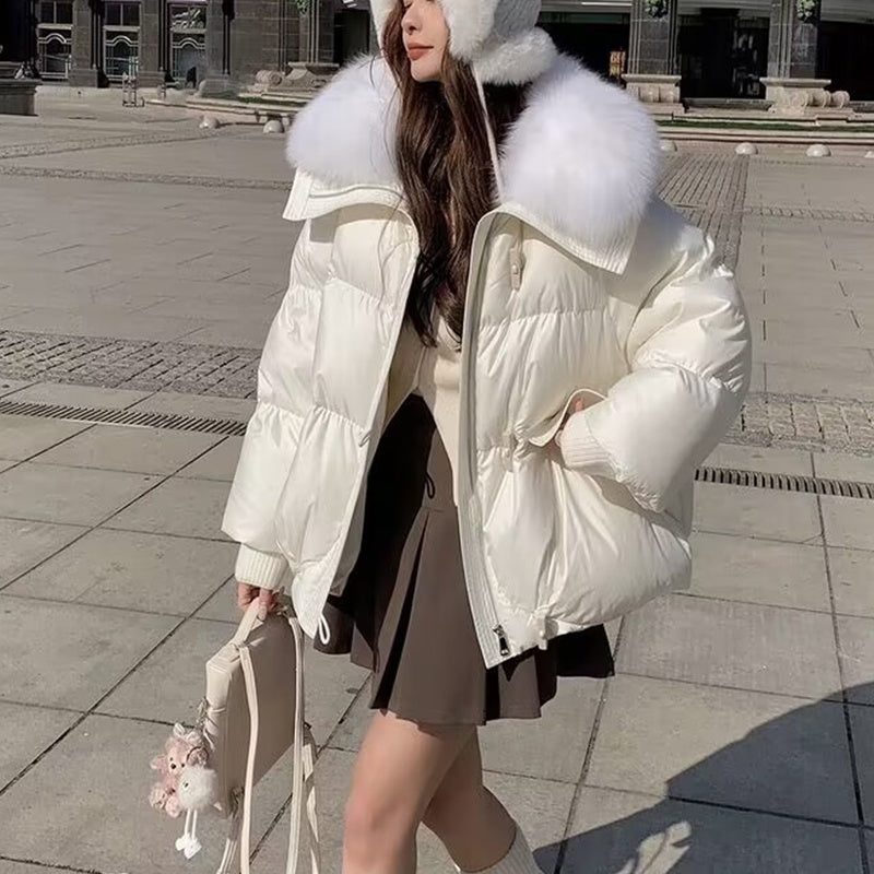 Down Cotton-padded Jacket Women's Short Fur Collar Thickened Coat in white worn with a skirt and accessories.