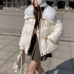 Down Cotton-padded Jacket Women's Short Fur Collar Thickened Coat in white worn with a skirt and accessories.
