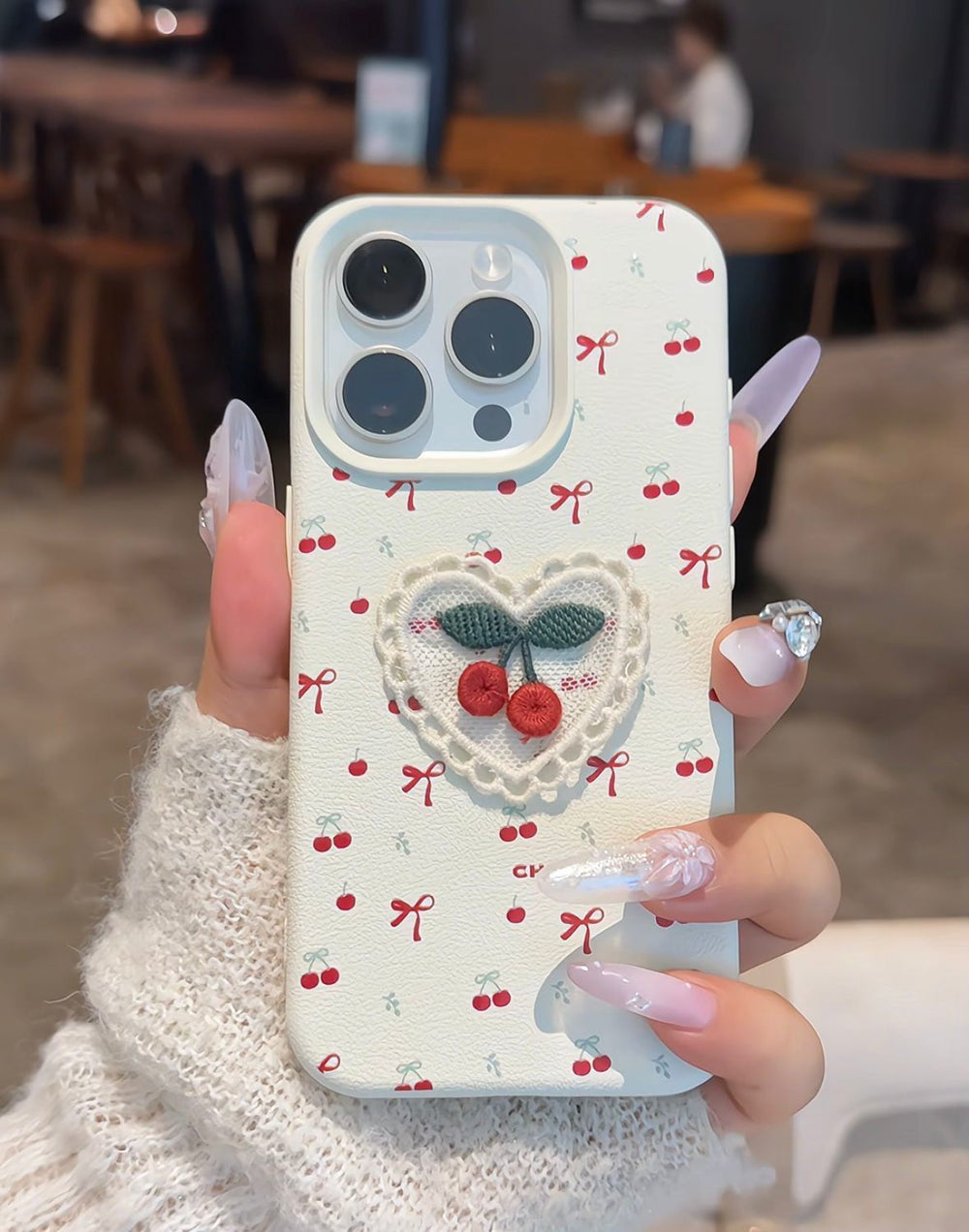 Ins Korean Style Embroidered Cherry Phone Case Leather Pattern featuring a litchi pattern and white cherry design.