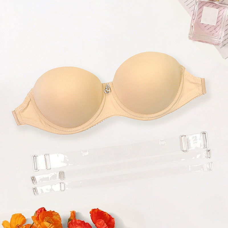European And American Ladies Transparent Push Up Bras in nude color with detachable straps on a white background.