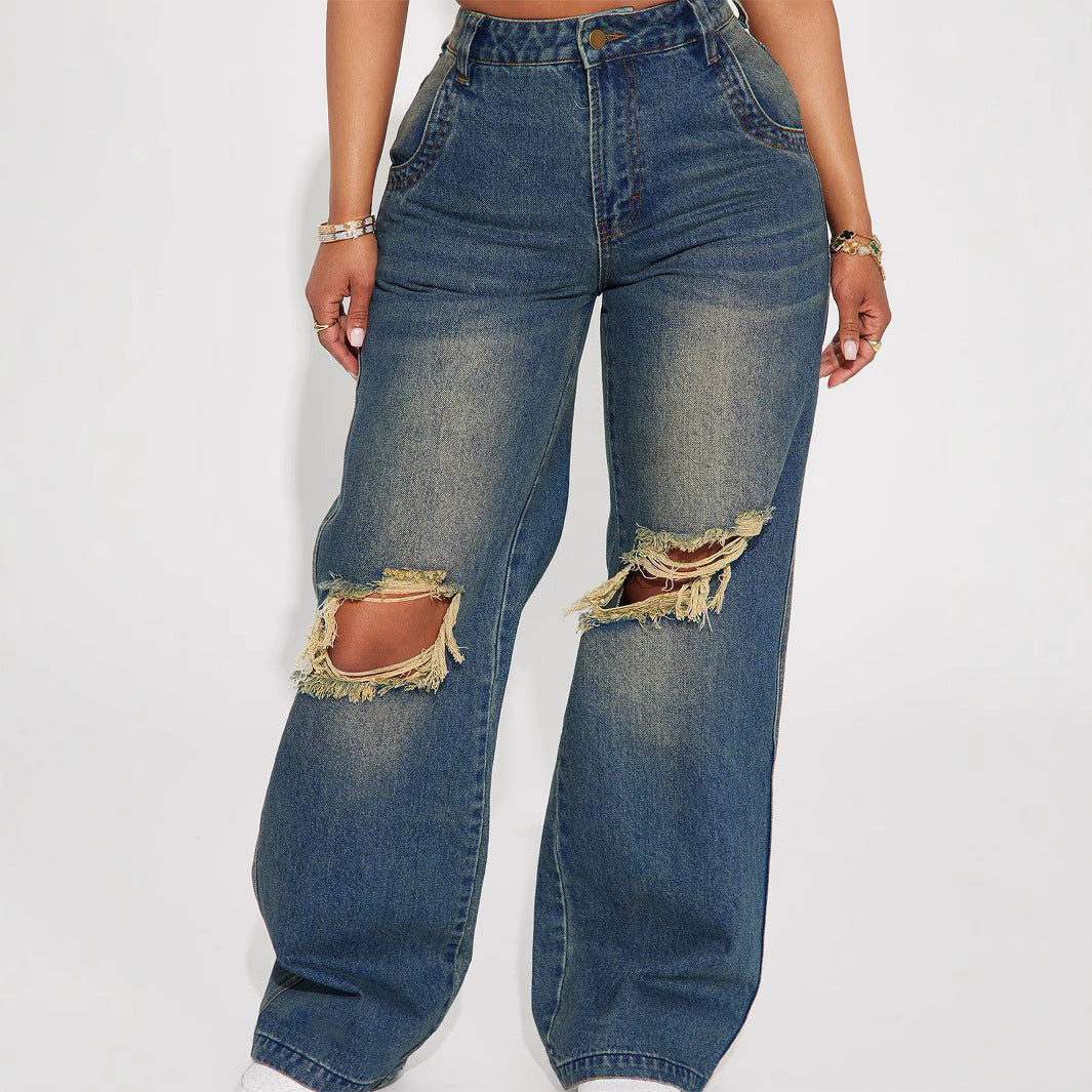 Model wearing Retro Heavy-duty Washed Knee Ripped Wide-legged Jeans in sea blue color with distressed knees.