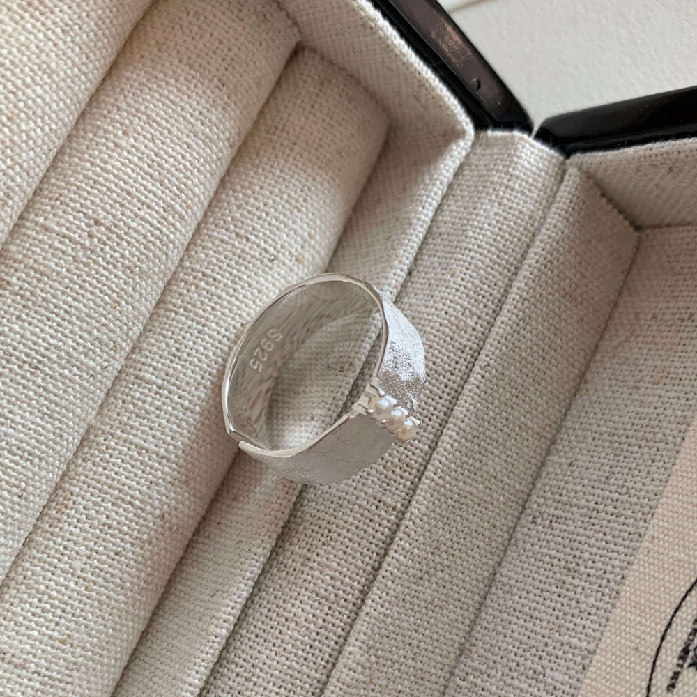 S925 Sterling Silver Brushed Pearl Ring For Women displayed in elegant jewelry box with soft texture.