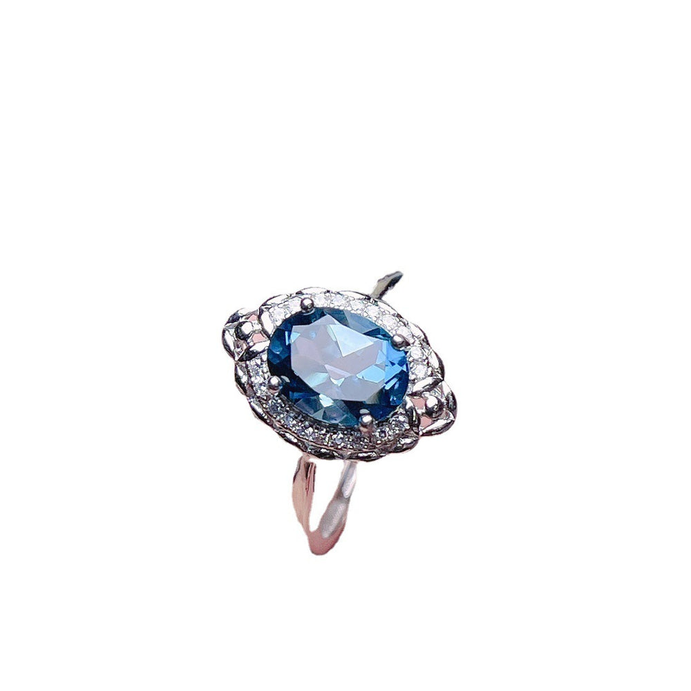 Jewelry Natural Topaz Ring S925 Silver with a stunning blue topaz gemstone and silver detailing.