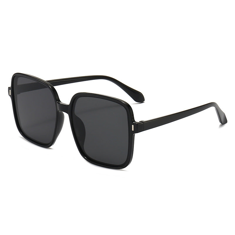 Men And Women With Fashion Simple Sunglasses with a stylish black frame and dark lenses