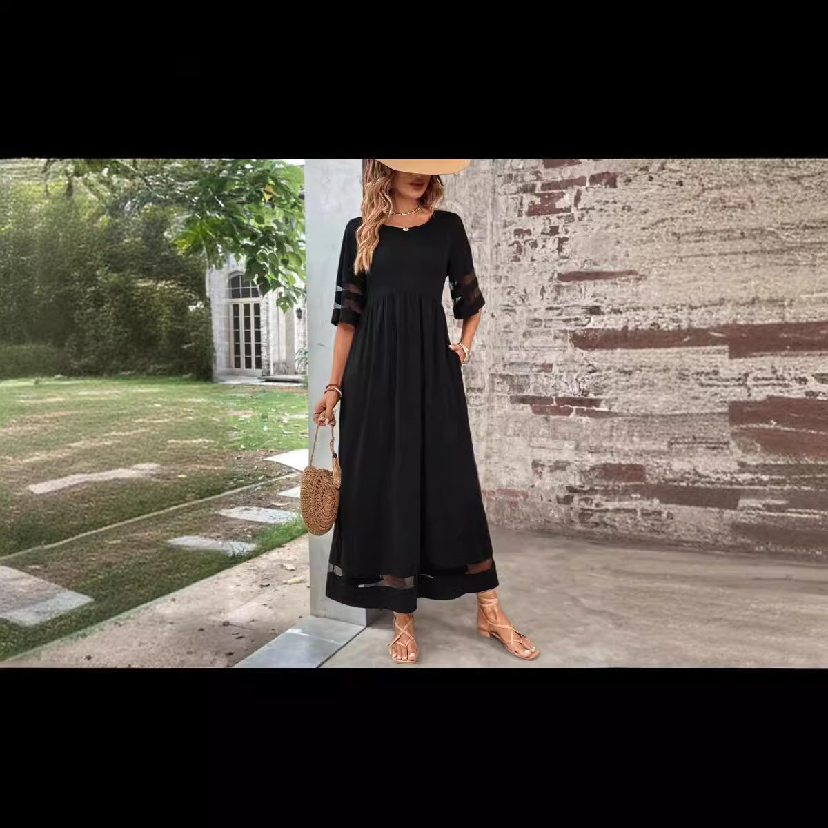 New Hot Sale Five-quarter Sleeve Mesh Patchwork Round Neck Pocket Dress in black worn outdoors.