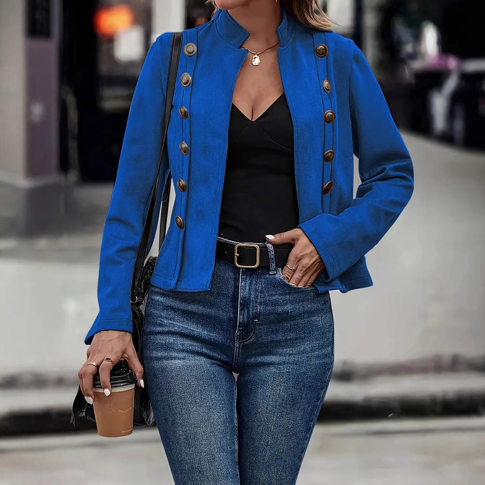 Double-row Metal Buckle Deerskin Velvet Retro Long-sleeved Coat in blue worn with jeans and a black top.