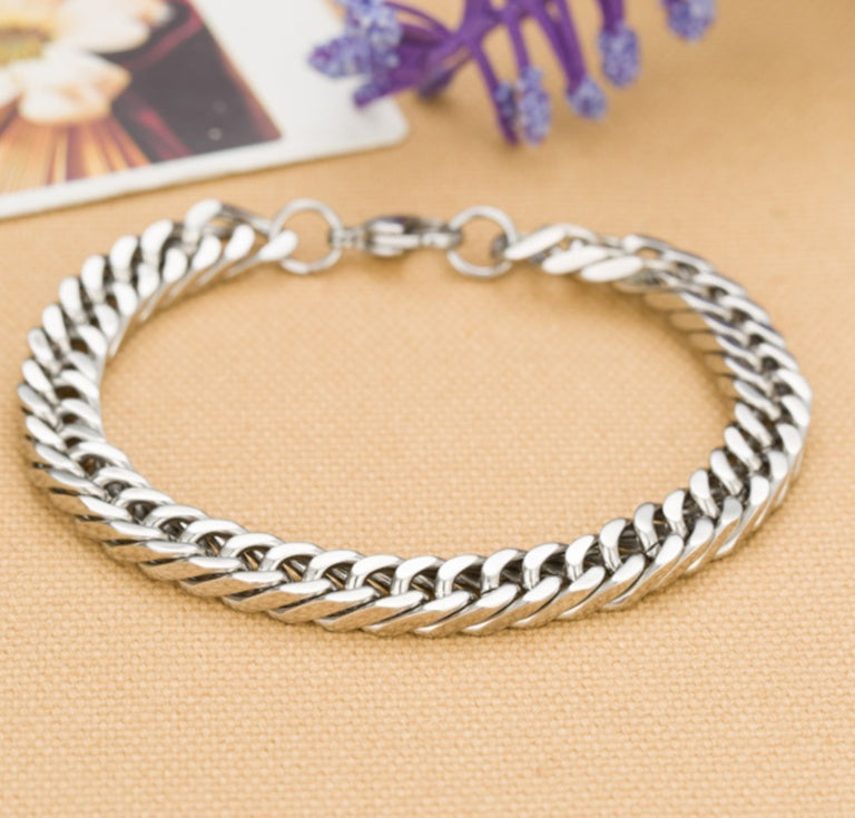 Titanium steel bracelet featuring a stylish geometric design with inlaid silver, perfect fashion jewellery for men.